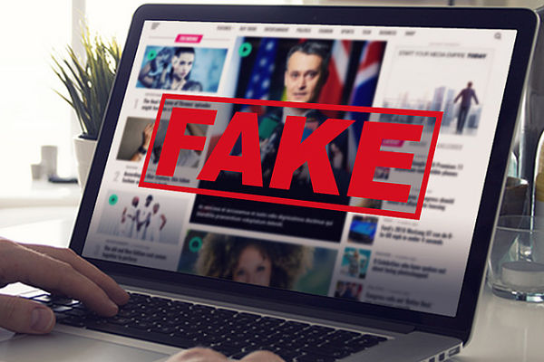 Fake news on laptop screen