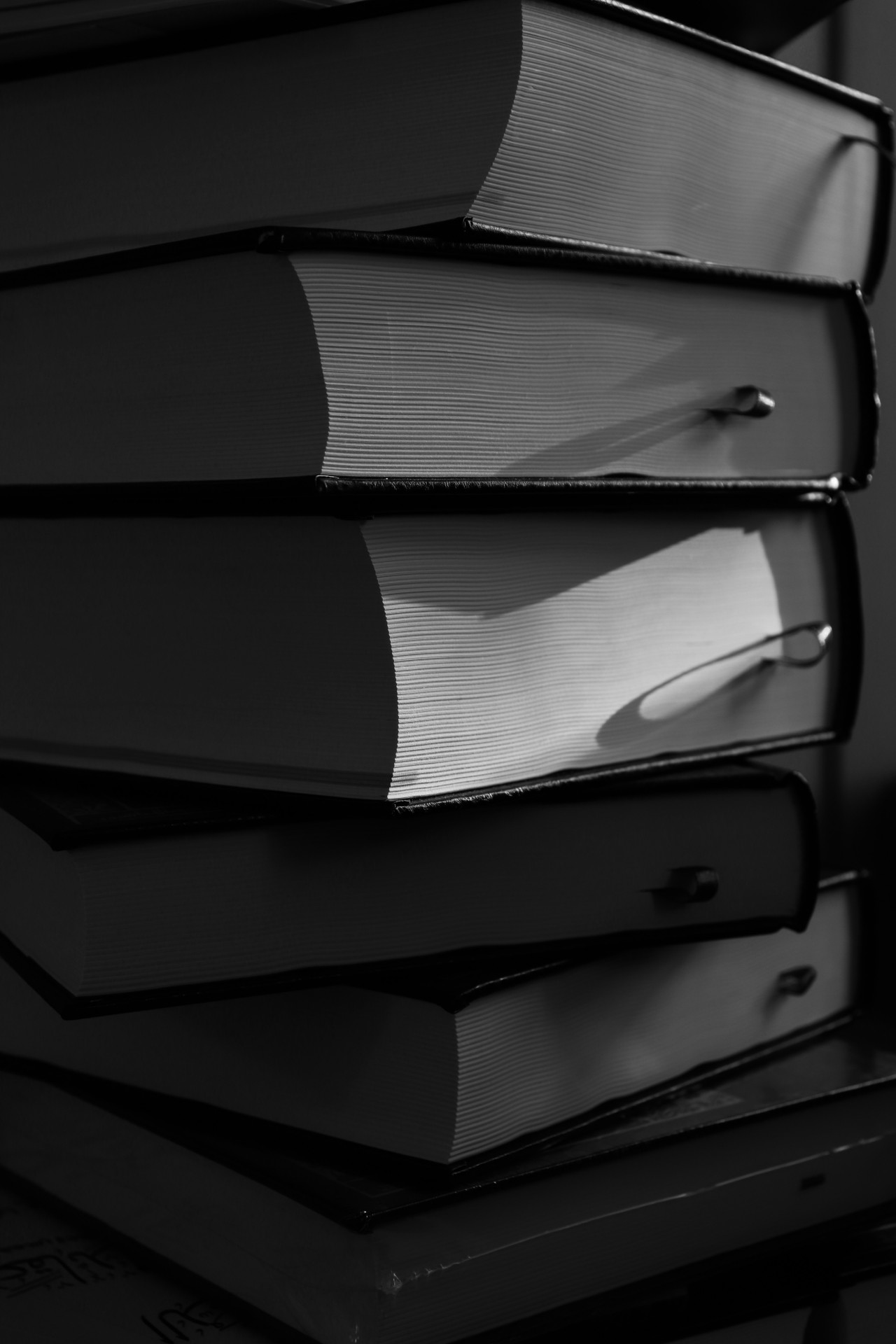 Thick books stacked on top of each other