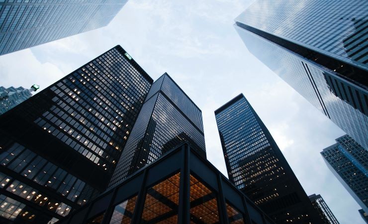 Image: low-angle photograph of city buildings.