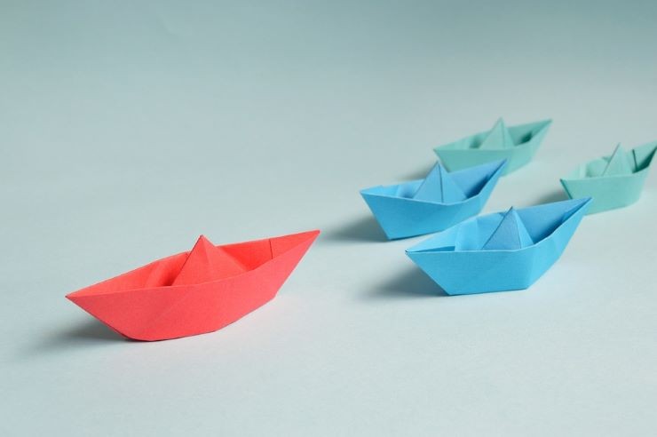 Origami boats racing.