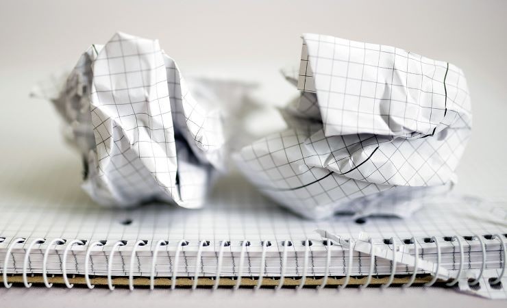 Photograph of crumpled sheets of graph paper.
