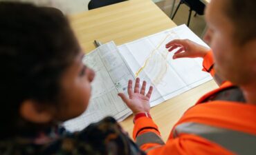 Engineering students in discussion over design work
