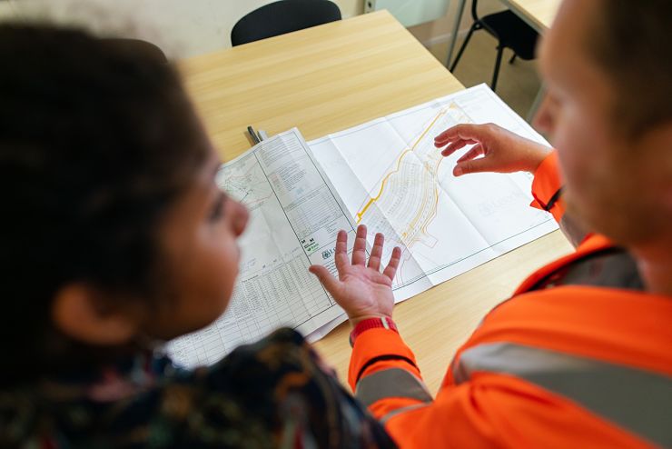 Engineering students in discussion over design work