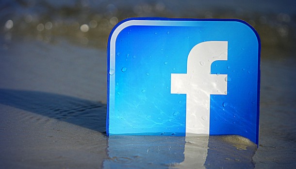 Facebook logo in sand