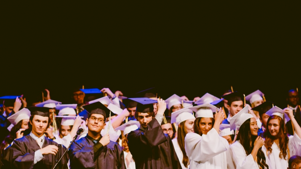 Graduating students shift their tassels.