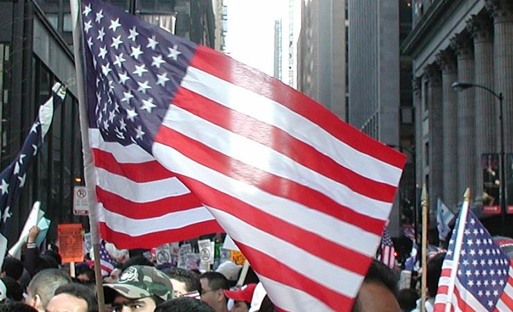 Light shines through American flag