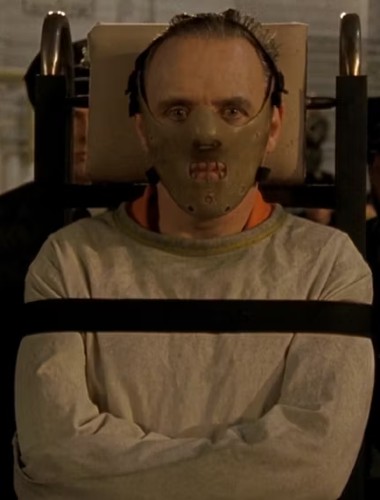 Actor anthony hokins in straightjacket and mask in iconic scene from movie 'silence of the mabs'