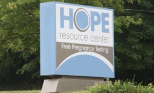 The sign in front of the Hope Resource Center on a grassy setting