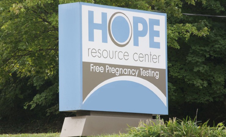The sign in front of the Hope Resource Center on a grassy setting