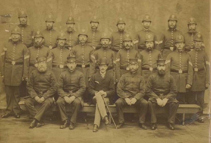 Group photo of 25 British constables in uniform from 1890  