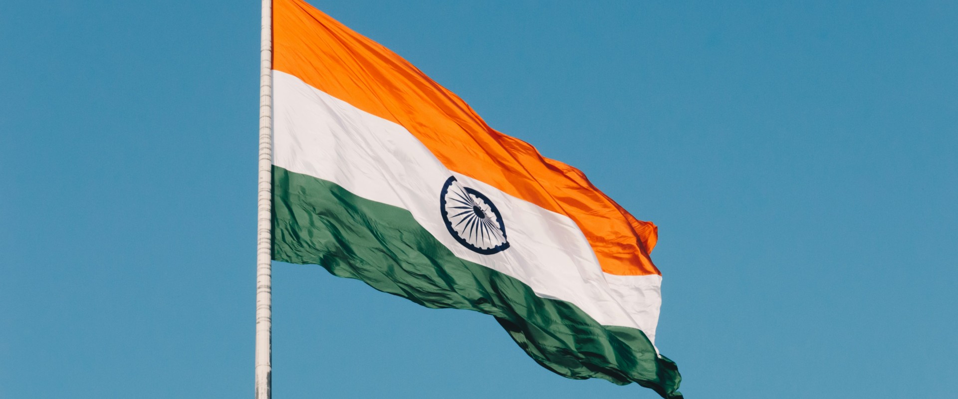 Flag of nation of India flying on pole