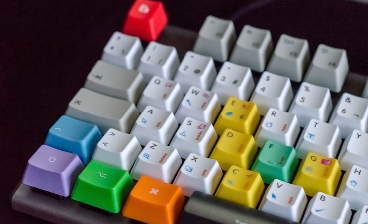 Close-up photo of computer keyboard with multicolor keys.