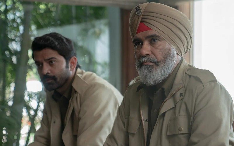 A still from the series Kohrra shows actors  Suvinder Vicky and Barun Sobti in police khakis and with pensive looks