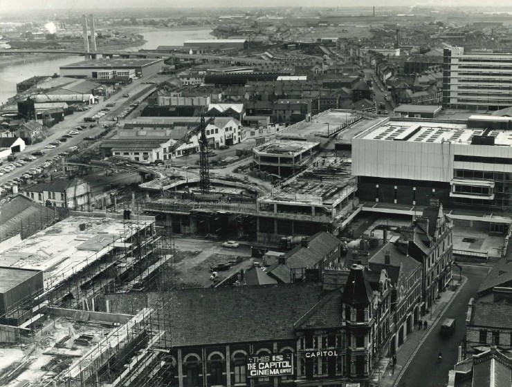 Aerial view of an urban downtown with construction and mix of Victorian buildings and modern block buildings