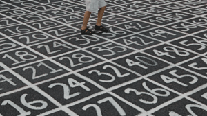 Grid of numbers written on asphalt