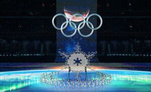 Opening ceremony of 2022 Olympics shows ice skaters circle giant snowflake