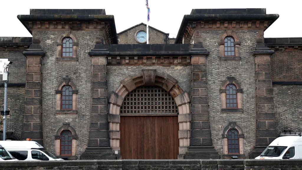 Exterior of the front gate leading into HM Prison Wandsworth, a stone building built in 1851