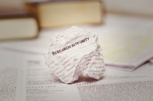research integrity written on wadded up piece of paper