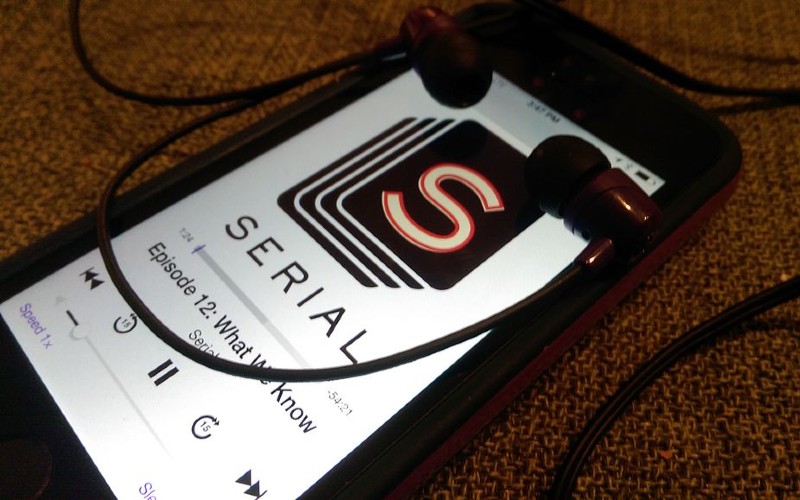 Mobile phone with Serial podcast episode 12, What We Know, showing on face