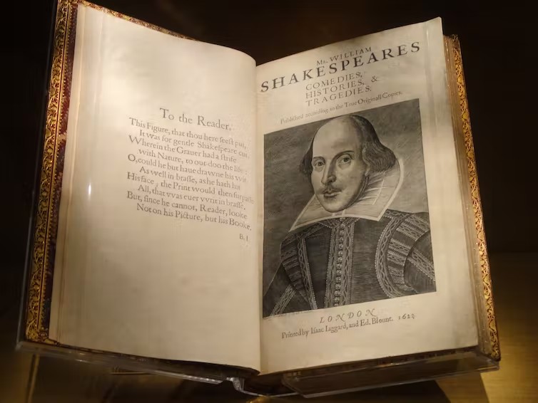 Very old bound book open to frontspiece and picture of Shakespeare