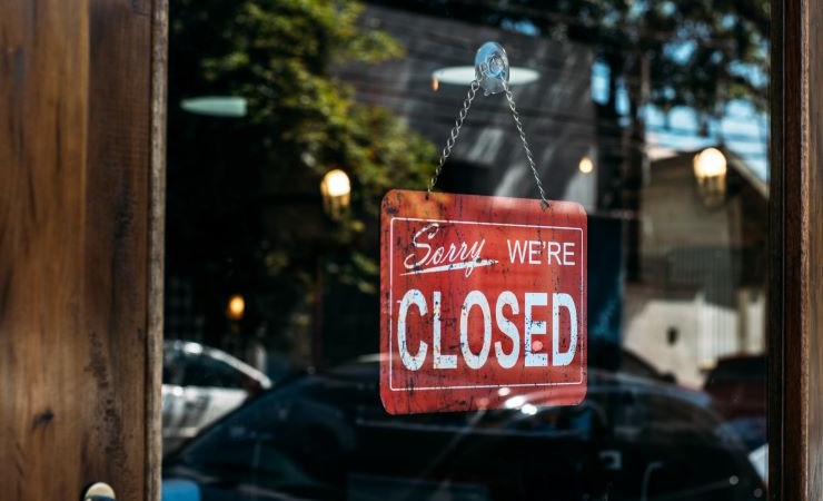 Image of red store sign that reads, "Sorry, We're Closed."