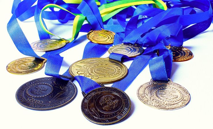 stack of blue ribbon medals