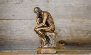Miniature statue of the Thinker.
