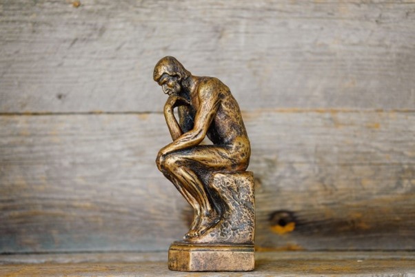 Miniature statue of the Thinker.