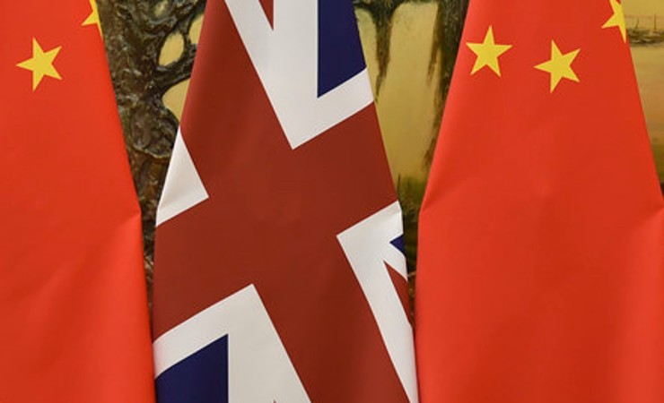 Union Jack displayed between two Chinese national flags