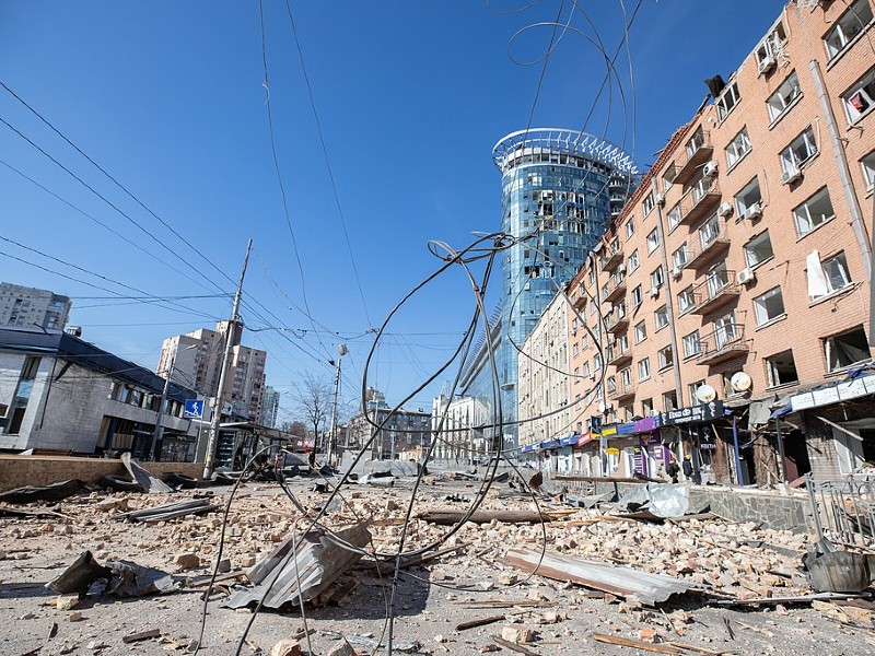 An urban street covered in rubble and loose wires