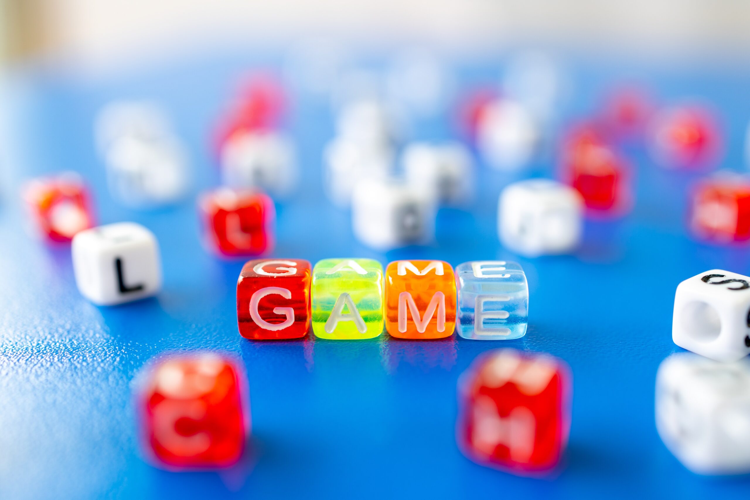 Beads spell out "game".
