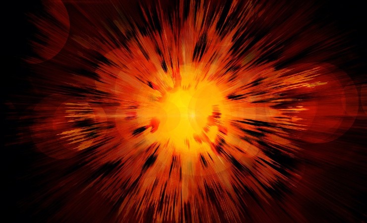 Depiction of big bang as explosion in orange and yellow