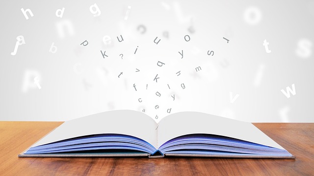 Photo shows an open book with letters coming out of it.
