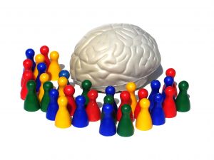 Multicolored figurines surround a white brain.