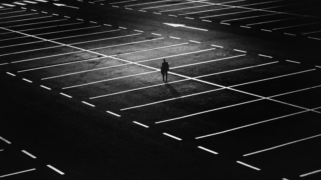 Solo figure in parking lot