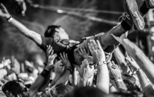 crowdsurfing at rock concert