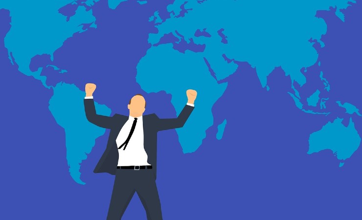 Drawing of a businessman with arms raised against backdrop of world map