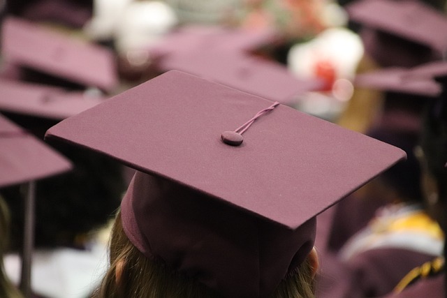 Maroon graduation caps viewed from the top. 