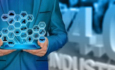 Man holds tablet with many icons representing jobs or fields of research coming out of tablet.