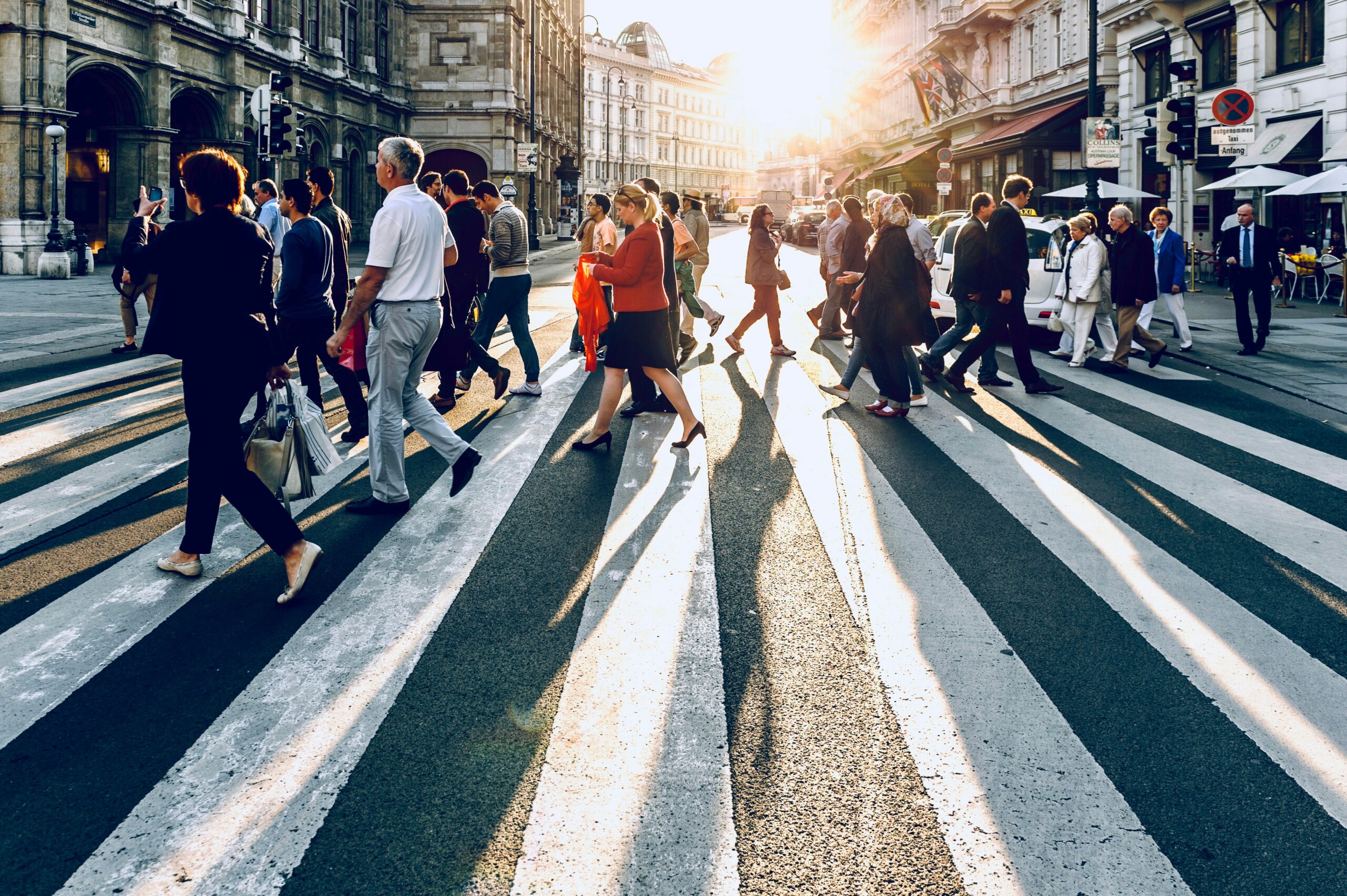 People walking across a crosswalk.