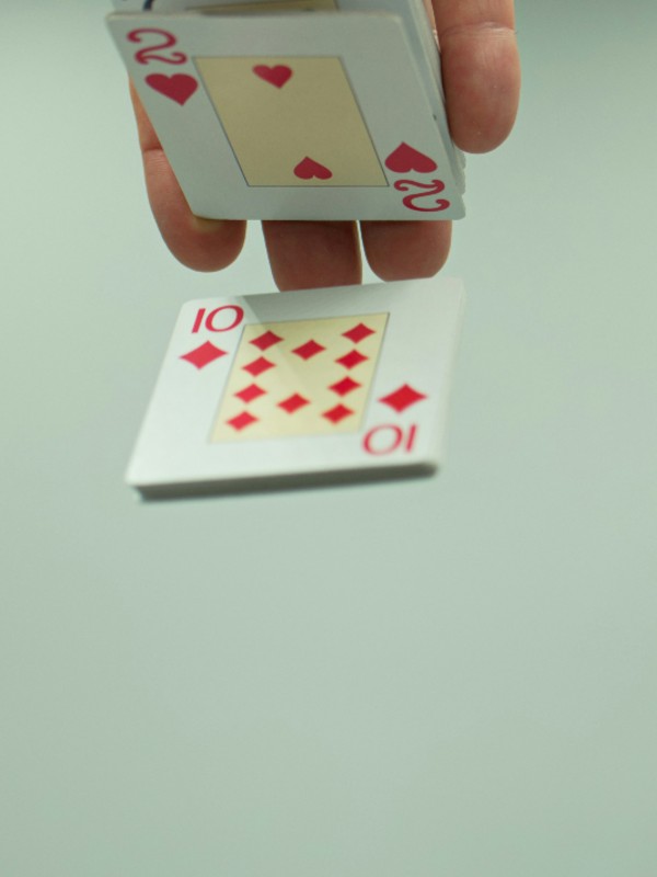 Closeup of hand palming playing cards