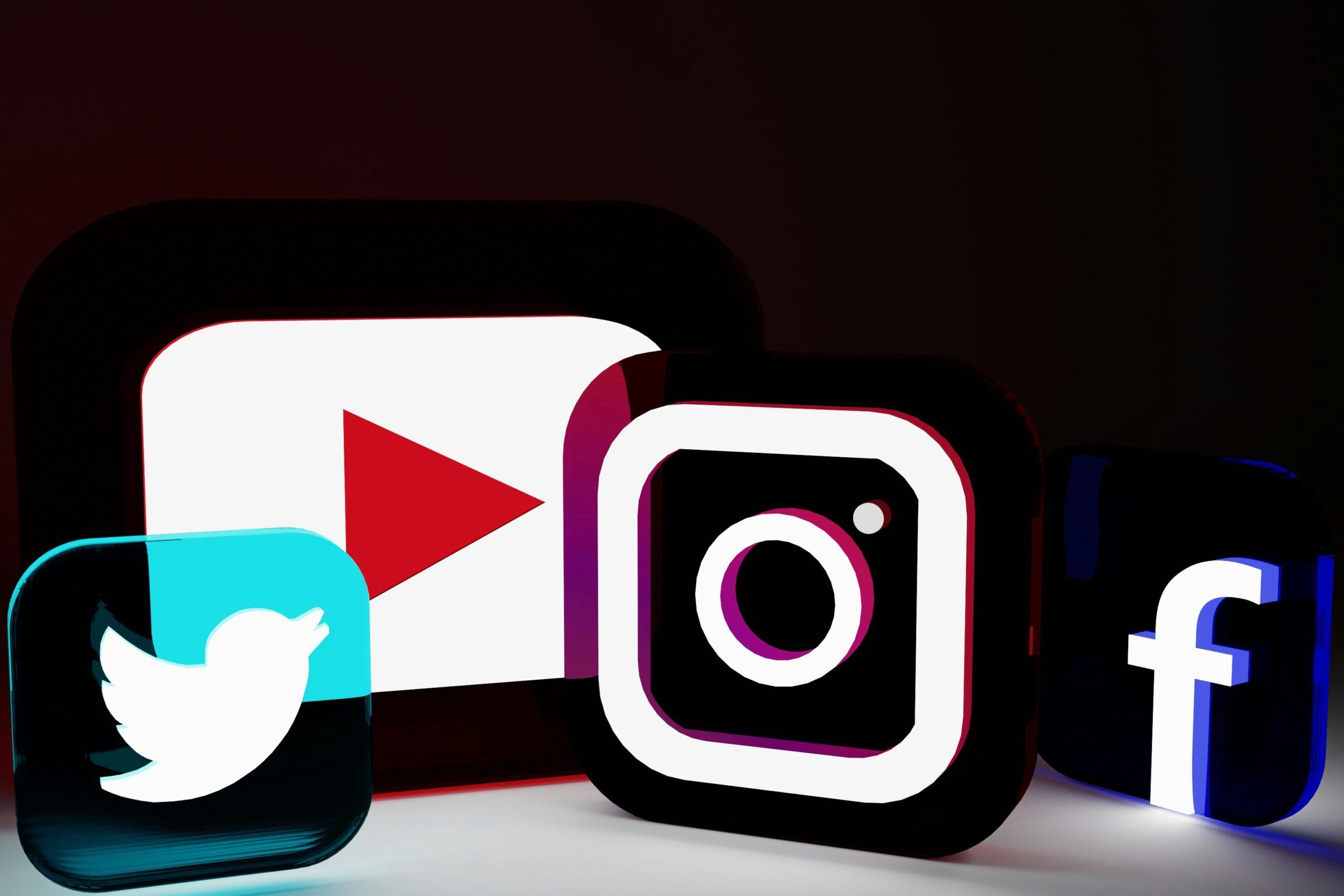 Logos of Twitter, YouTube, Instagram and Facebook creatively arrayed
