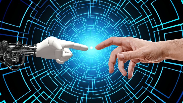 Robot finger and human finger pointed toward each other.